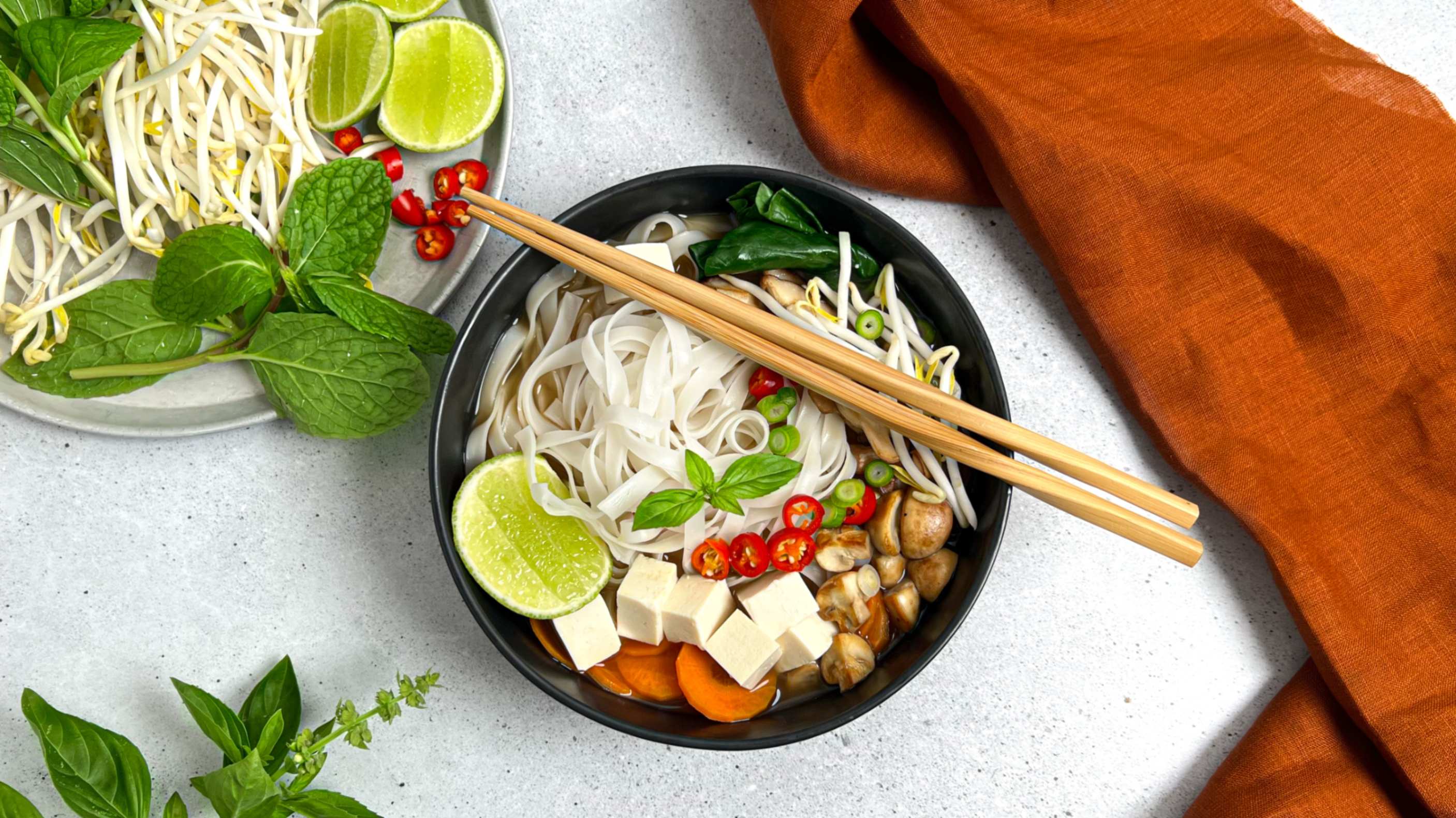 Heartful Flavours Vietnamese Pho Recipe Lifestyle Aerial Shot with garnishes